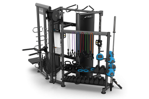 Black and silver multi-station gym equipment with punching bag, leg press, and cable machine on white background