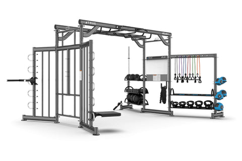TRUE Atlas HD multi-station gym system with black metal frame, suspension trainer, dumbbell storage, and cable machine statio