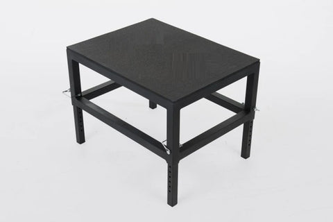 Black metal adjustable plyo box with rectangular top and open frame design on white background