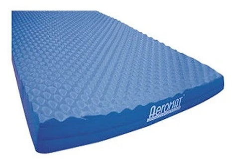 Blue Aeromat balance pad with textured top surface and solid blue base, angled view on white background