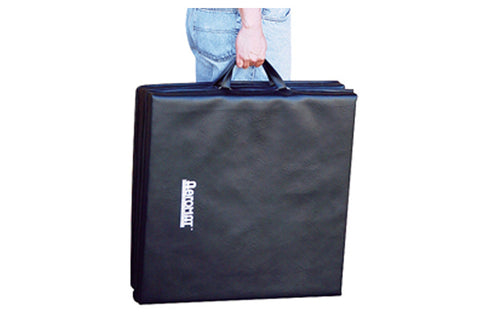 Black tri-fold carrying case with blue trim and handle, held by person wearing light blue jeans