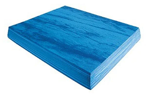 Blue foam balance pad with textured top surface and layered edge, angled view on white background