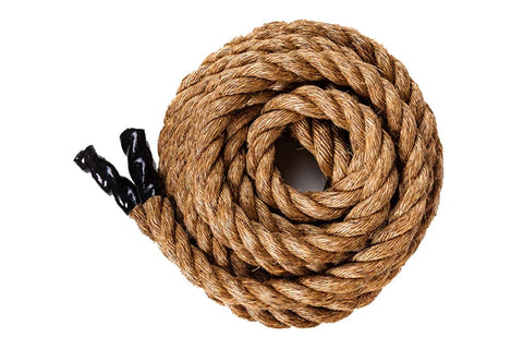 Coiled natural manila rope with black handles on white background, flat lay view