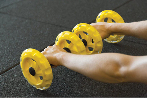 SKLZ COREwheels ab roller with bright yellow translucent wheels and black foam handles on white background