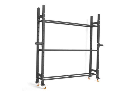 Black metal weight storage rack with three shelves holding colored weight plates, medicine balls, and dumbbells, on white bac