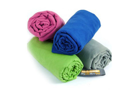 Four rolled microfiber towels in pink, blue, green, and gray with Drylite Micro Towel label on white background