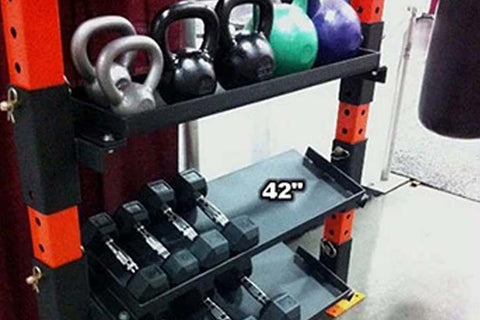 Red and black 42-inch kettlebell and dumbbell rack attachment holding various weights and colored medicine balls
