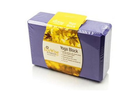 Purple foam yoga block with yellow and gold product label wrap, on white background