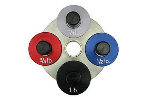 Warrior Fractional Add-On Plates in gray, red, blue, and black with weight labels 1/4lb, 3/4lb, 1/2lb, and 1lb, displayed on 