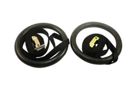 Pair of black gym rings with gold-tone metal handles on white background