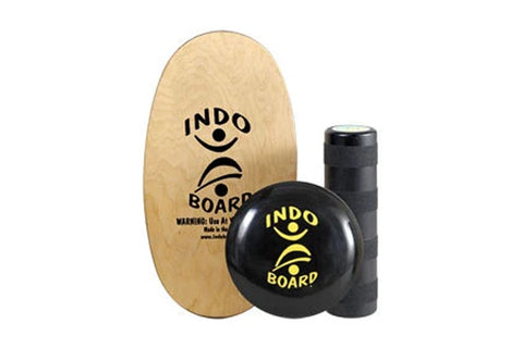 Warrior Indo Board Original balance training set with wooden oval board, black wobble ball, and black cylinder roller on whit