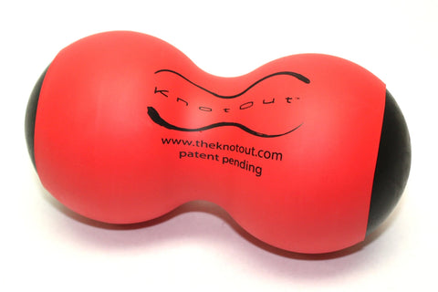 Red and black firm massage roller with curved figure-eight shape and branding text, shown on white background