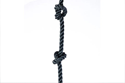 Black twisted climbing rope with knots at top and middle sections on white background