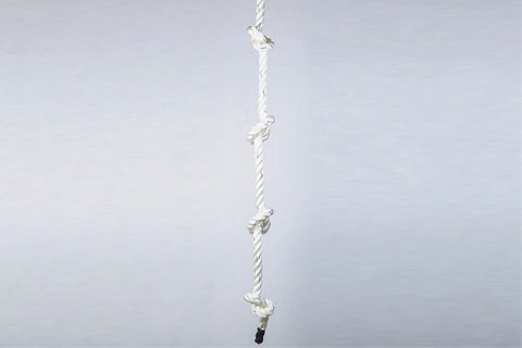 White twisted climbing rope with knotted handholds spaced evenly, black grip base, on light background