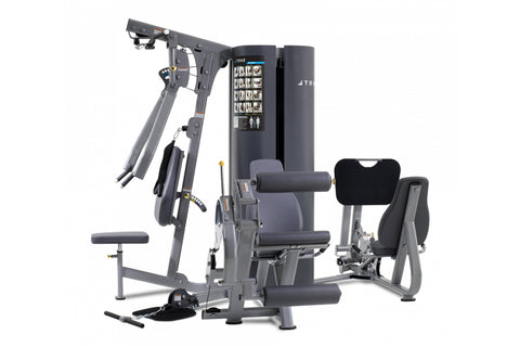 Multi-station home gym with gray frame, digital display, and black padded seat and backrest, featuring adjustable cable resis