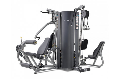 TRUE MP 4.0 commercial home gym with black frame, central tower, dual weight stacks, leg press attachment on left, and seated