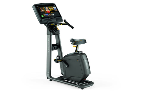 Matrix U50 upright exercise bike with gray frame, black seat, and digital display console on white background