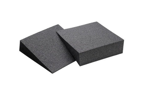 Pair of charcoal gray foam wedge blocks, one angled and one flat, on white background