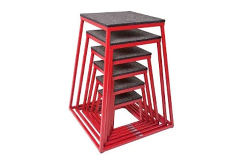 Set of five red metal plyo boxes with black textured tops, nested for storage, on white background