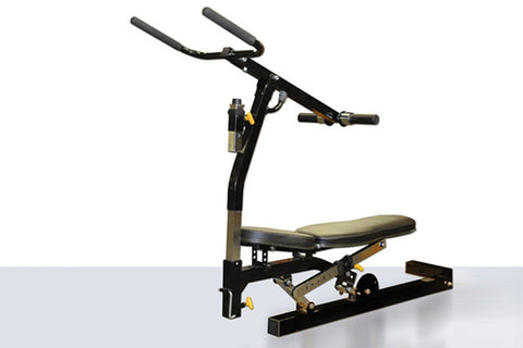 Black and tan dip machine attachment with dual handles, padded seat, and foot platform on white background