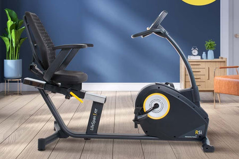 Black LifeSpan R5i recumbent exercise bike with yellow accent, padded seat, adjustable backrest, and console display on white