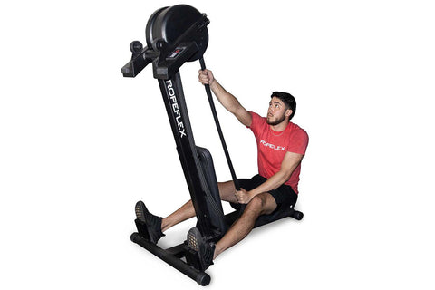 Man in red shirt using black Ropeflex RX2300 rope trainer with dual position design on white background