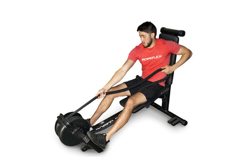 Man in red shirt using black Ropeflex RX2300 rope trainer with dual position design on white background