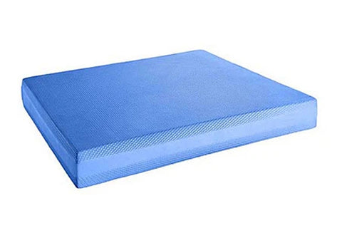 Blue balance pad with textured surface and curved edges on white background