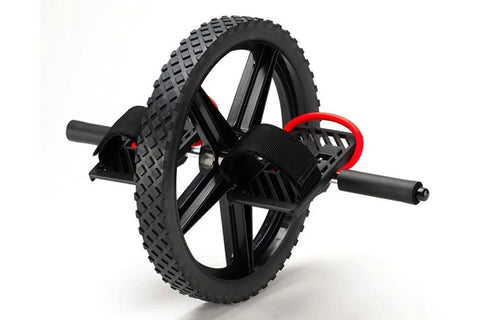 Sklz Power Wheel exercise tool with black rubber tire, black spoke wheel, and red handlebar grips on white background