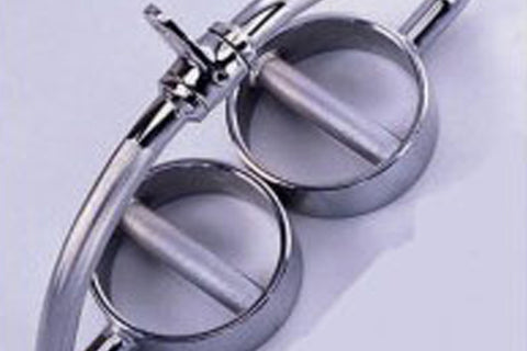 Warrior solid dual circle pull and press down bar with chrome handles and circular weight plates on lavender background