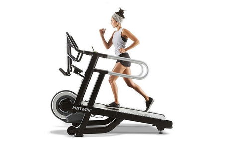 Black motorized treadmill with dual handrails, digital display, and textured running belt on white background