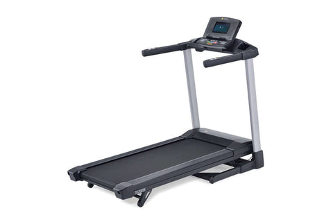 Woman running on black and gray LifeSpan TR2000i folding treadmill wearing white sports bra and black leggings
