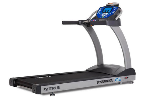 True Performance 100 treadmill with gray frame, black running deck, and blue digital display console on white background