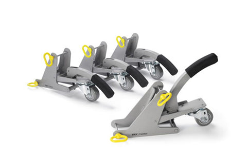 Gray and yellow TRX Castors with black foot pedals and wheels, shown in flat lay arrangement on white background