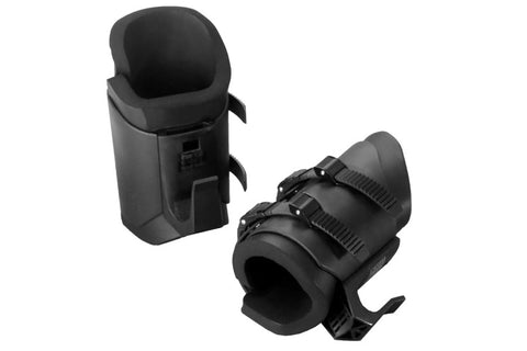 Black gravity inversion boots with ankle straps and protective carrying case on white background