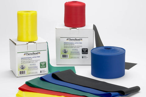 Thera-Band Professional latex-free resistance bands in yellow, red, green, blue and black, displayed as rolled and flat sampl