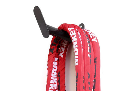 Red and white Warrior Undulation rope with black hanger hook on white background