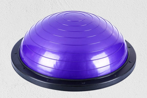 Purple balance ball trainer dome with black base on white background