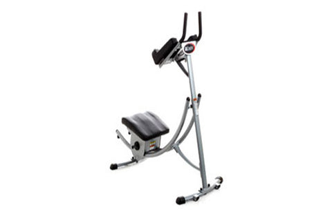 Warrior Ab Coaster upright exercise machine with silver metal frame, black padded seat and handlebar, on white background