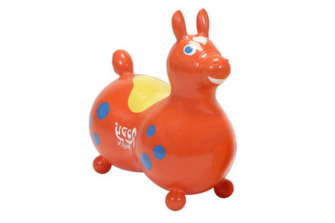Red inflatable bouncy horse toy with blue polka dots, yellow saddle, upright ears, and rolling wheels on white background