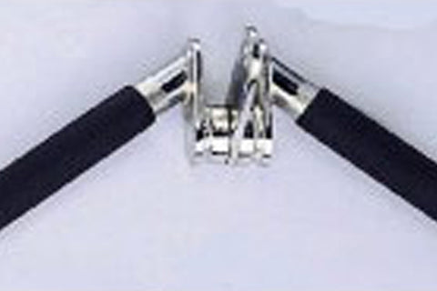 Warrior rotating balance press down bar with black foam handles and chrome rotating mechanism, overhead view on white backgro