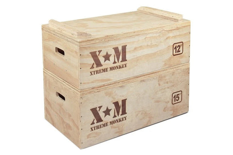 Plyometric wooden jerk blocks set with three stacked boxes labeled 6", 12", and 15" in natural pine with red Xtreme Monkey br