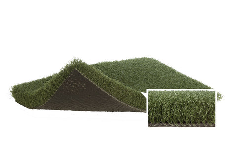 Bright modern gym with artificial green turf flooring, white lane markings, and functional training equipment including weigh