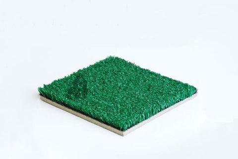 Artificial turf sample with bright green pile on tan backing, shown at angle on white background