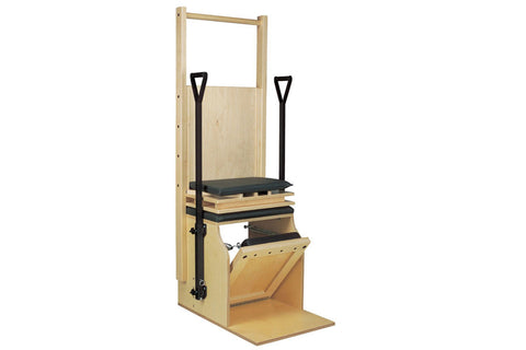 Light wood Pilates chair with black handles and pedal, featuring adjustable footrest and seat, shown on white background