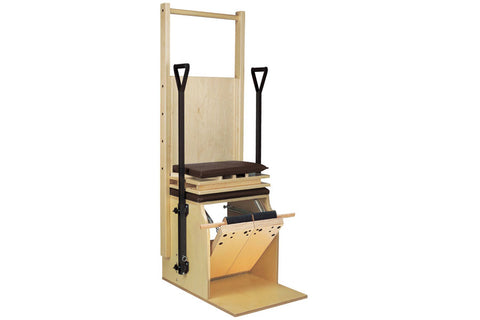 Natural wood pilates chair with black metal frame, padded seat, footbar, and split pedal mechanism on white background