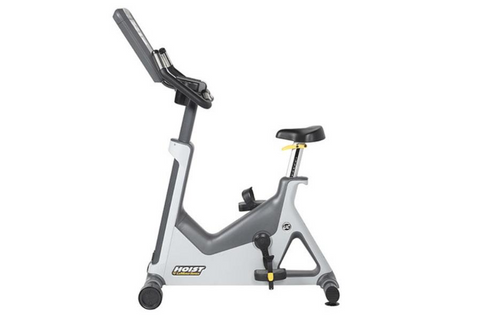Hoist Lemond Series UT upright exercise bike with gray frame, black seat and handlebars, digital console display, and yellow 