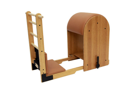 Wood and tan leather Pilates ladder barrel with arched back support, ladder column, and footplate on white background