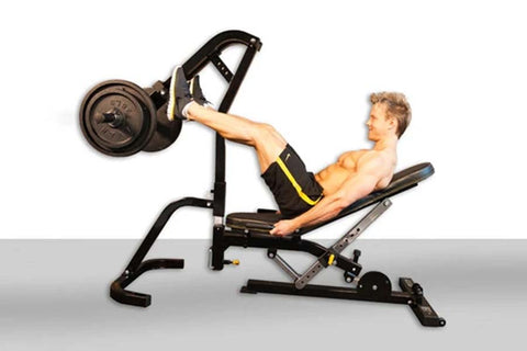 Black and gray leg press attachment with weight plate, demonstrated by shirtless male model on adjustable bench with footplat