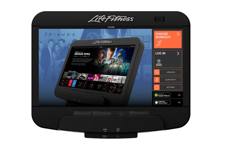 Life Fitness arc trainer with black and silver frame, curved handles, footplates, and digital console on white background